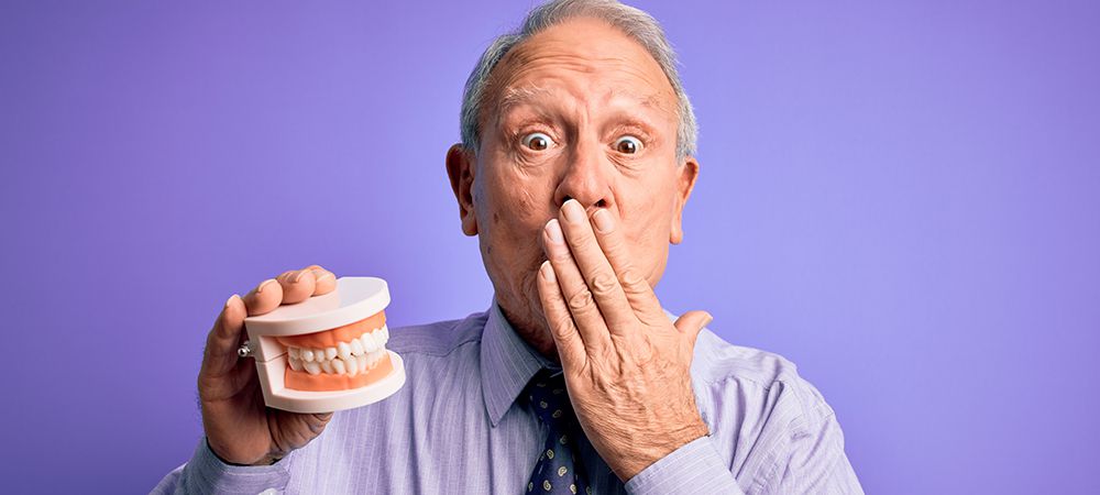 tell if someone is wearing dentures