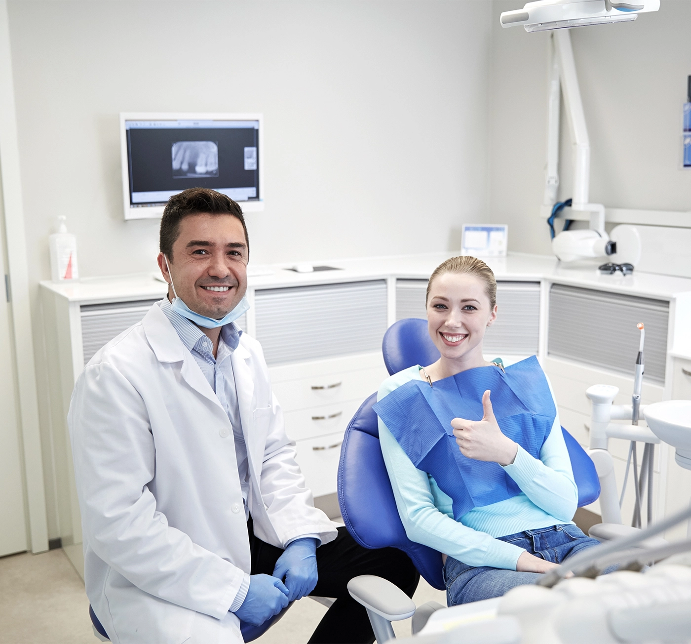 happy patient and dentist in clinic